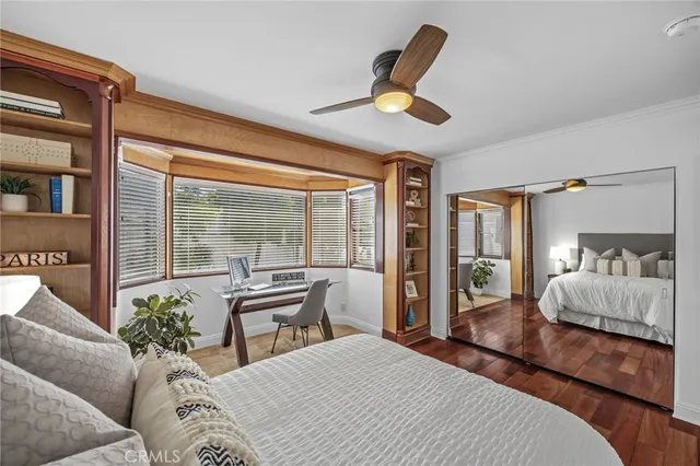 a bedroom with a large bed and a large window