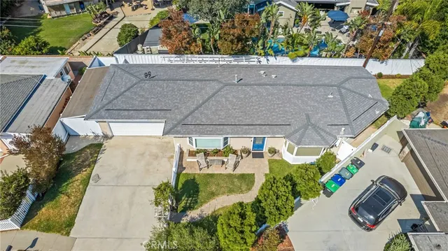 an aerial view of a house with outdoor space