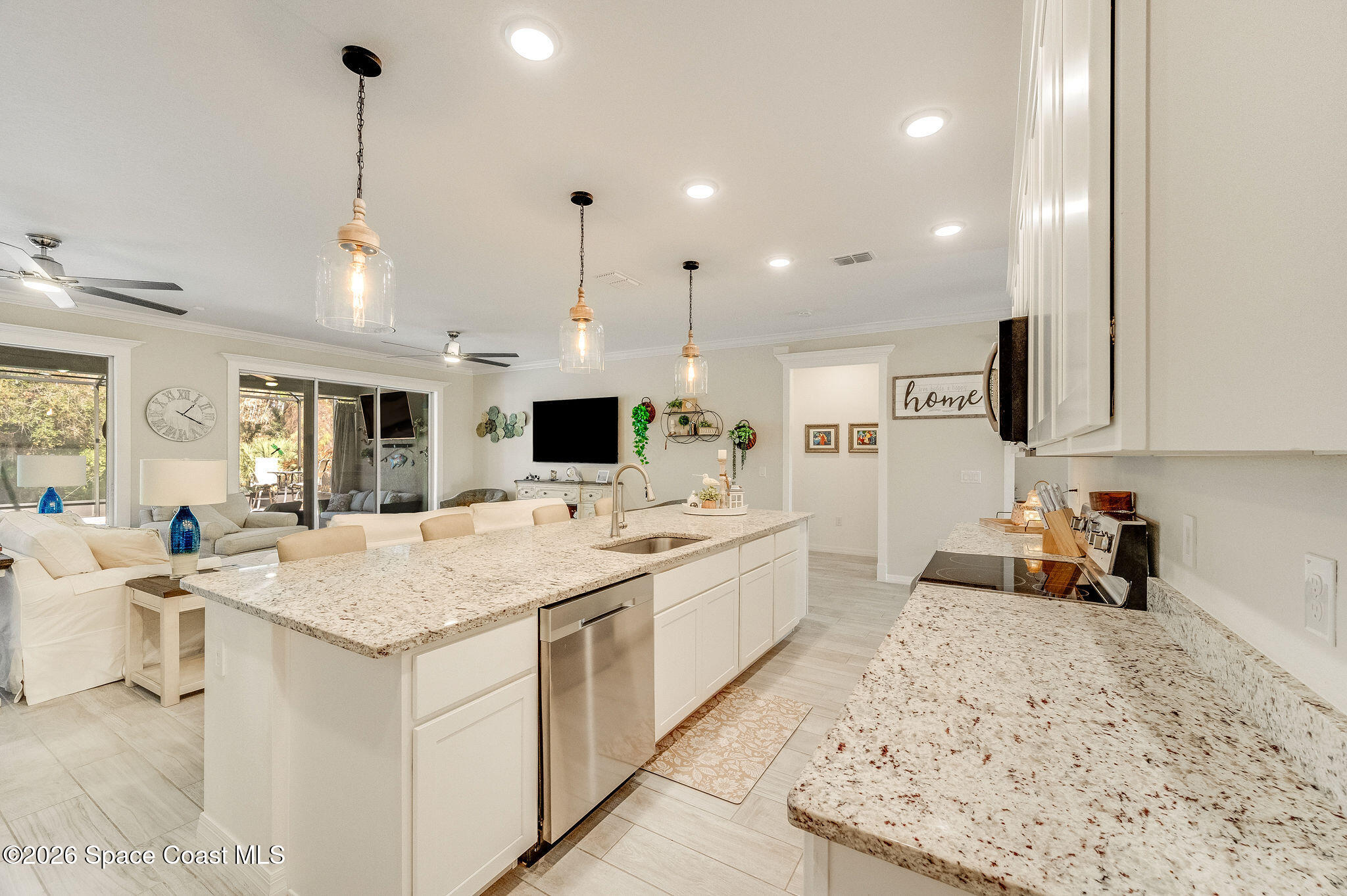 3470 Breezy Point Lane Cocoa, FL 32926 - Photo 13 of 69 a large kitchen with kitchen island a sink appliances and cabinets