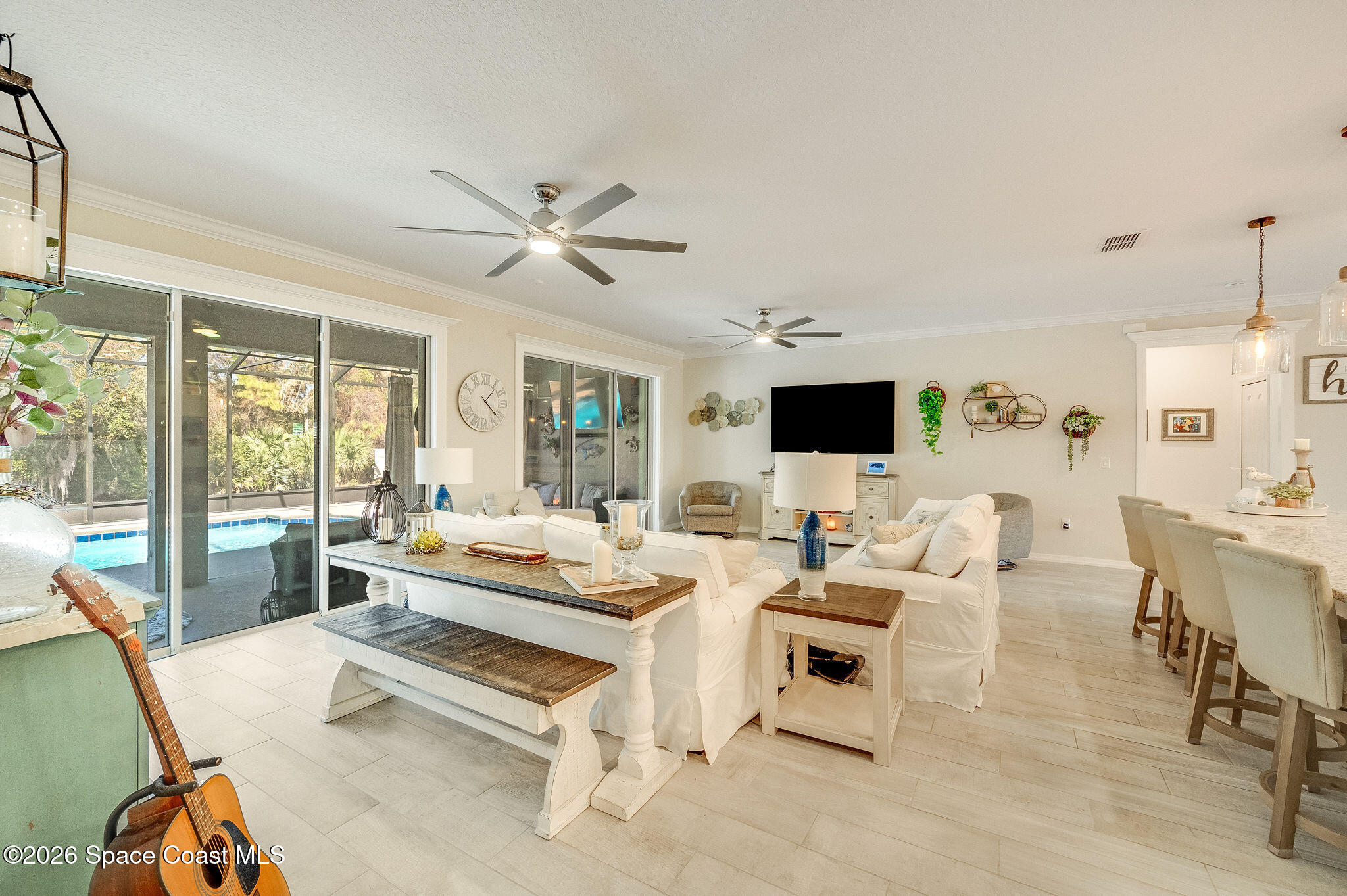 3470 Breezy Point Lane Cocoa, FL 32926 - Photo 15 of 69 a living room with furniture and a flat screen tv