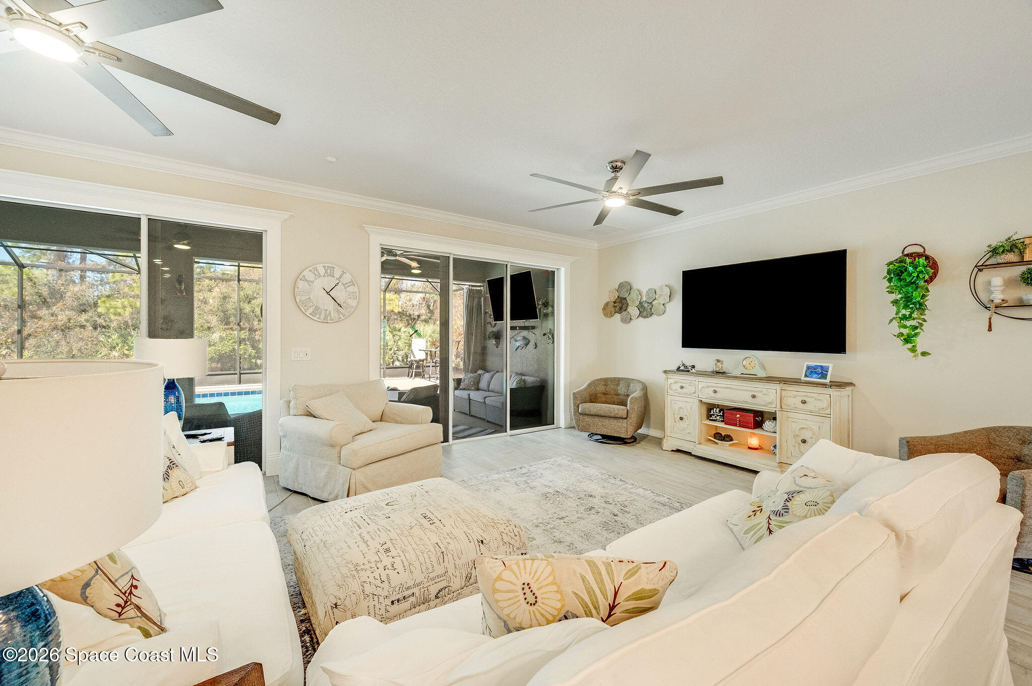 3470 Breezy Point Lane Cocoa, FL 32926 - Photo 17 of 69 a living room with furniture and a flat screen tv