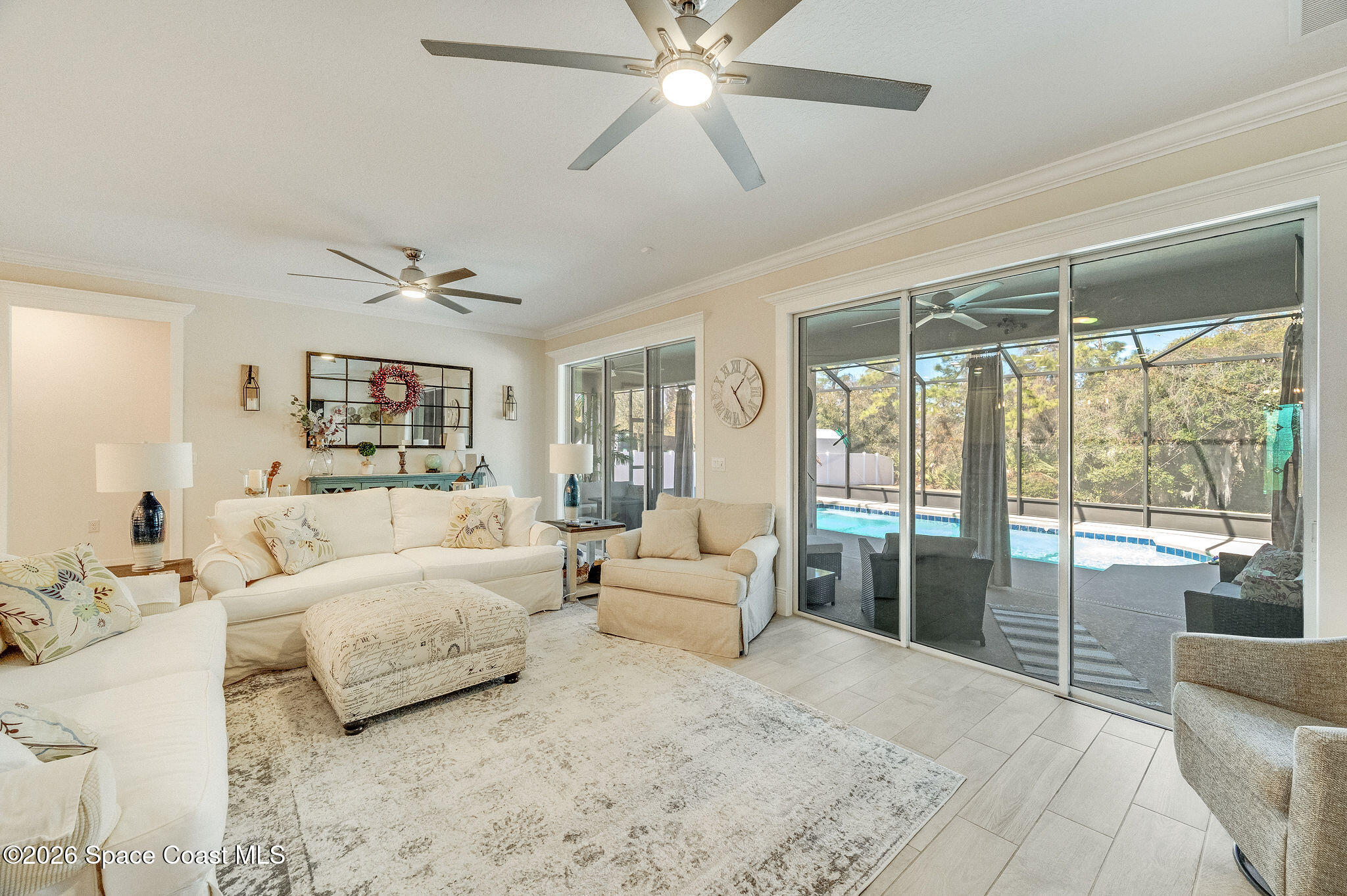 3470 Breezy Point Lane Cocoa, FL 32926 - Photo 23 of 69 a living room with furniture and a large window