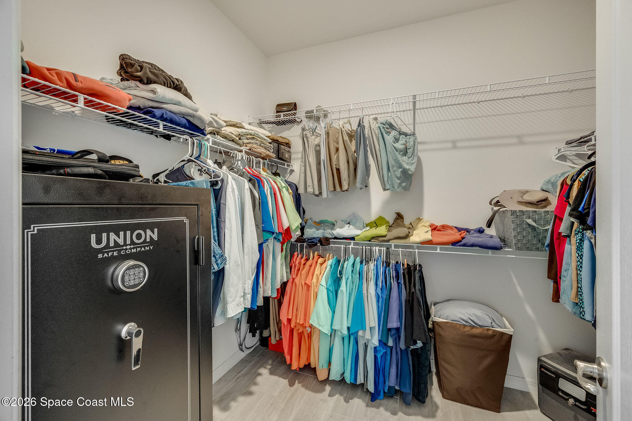 3470 Breezy Point Lane Cocoa, FL 32926 - Photo 27 of 69 a view of walk in closet with clothes and shoes