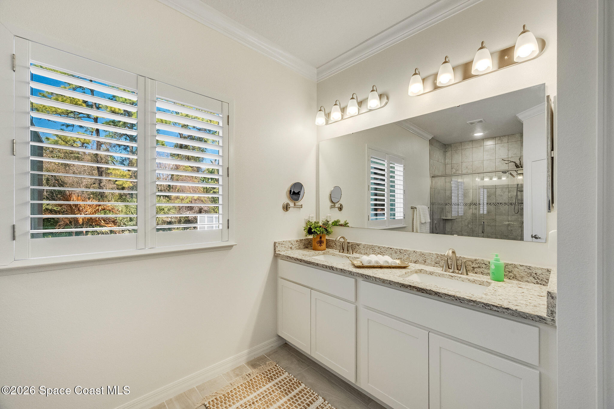 3470 Breezy Point Lane Cocoa, FL 32926 - Photo 29 of 69 a bathroom with a sink and a mirror