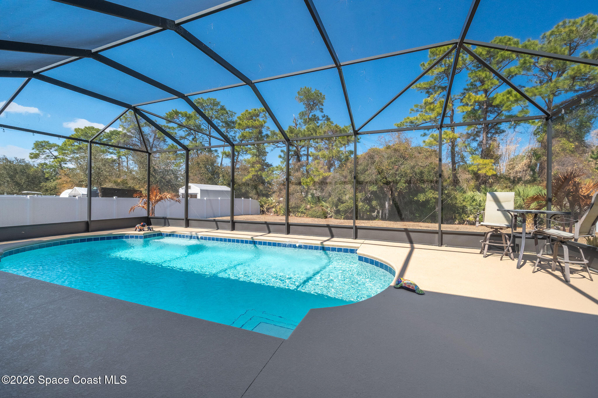 3470 Breezy Point Lane Cocoa, FL 32926 - Photo 39 of 69 a view of a swimming pool with a patio