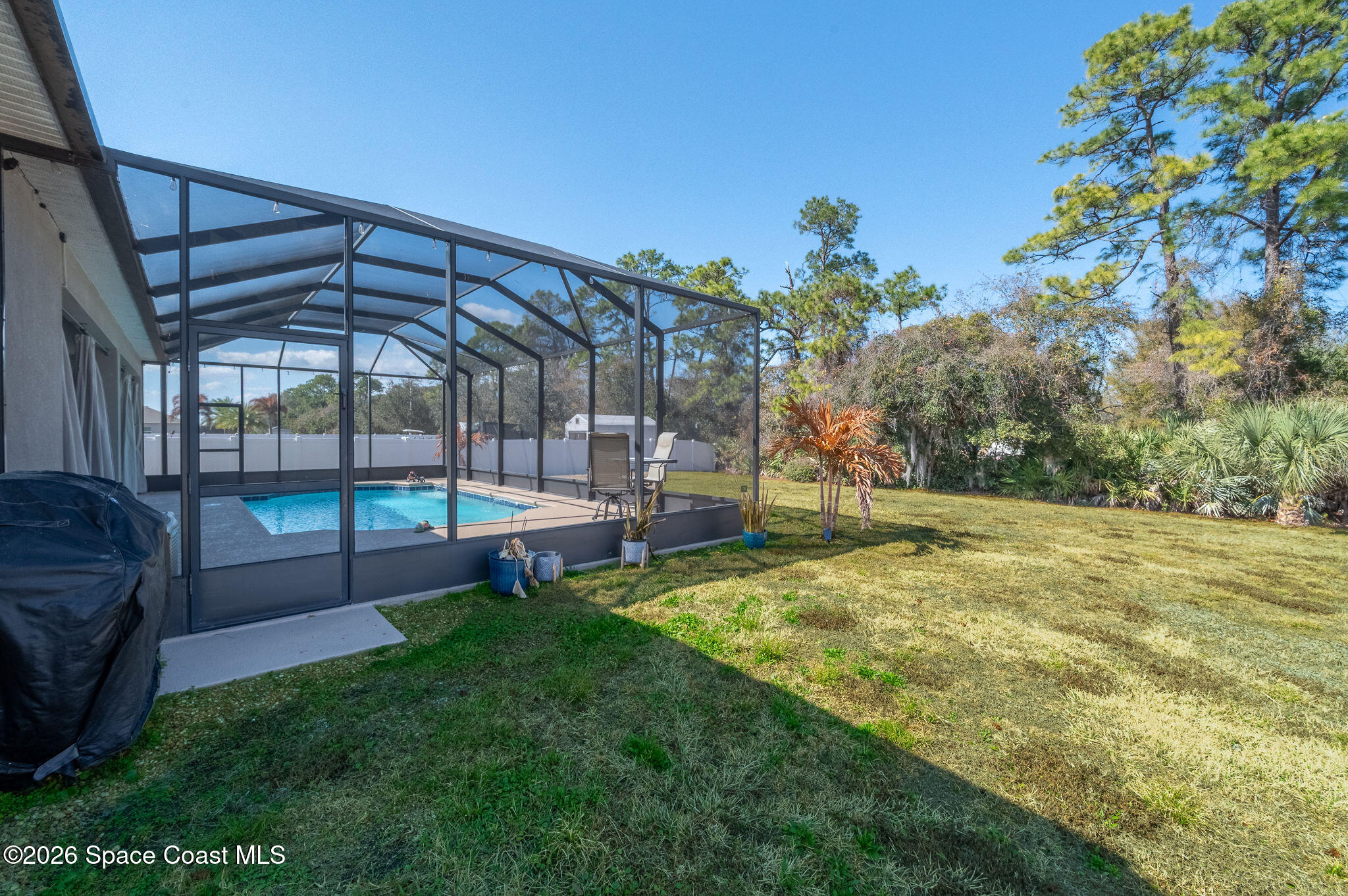 3470 Breezy Point Lane Cocoa, FL 32926 - Photo 41 of 69 a view of a backyard with a swimming pool