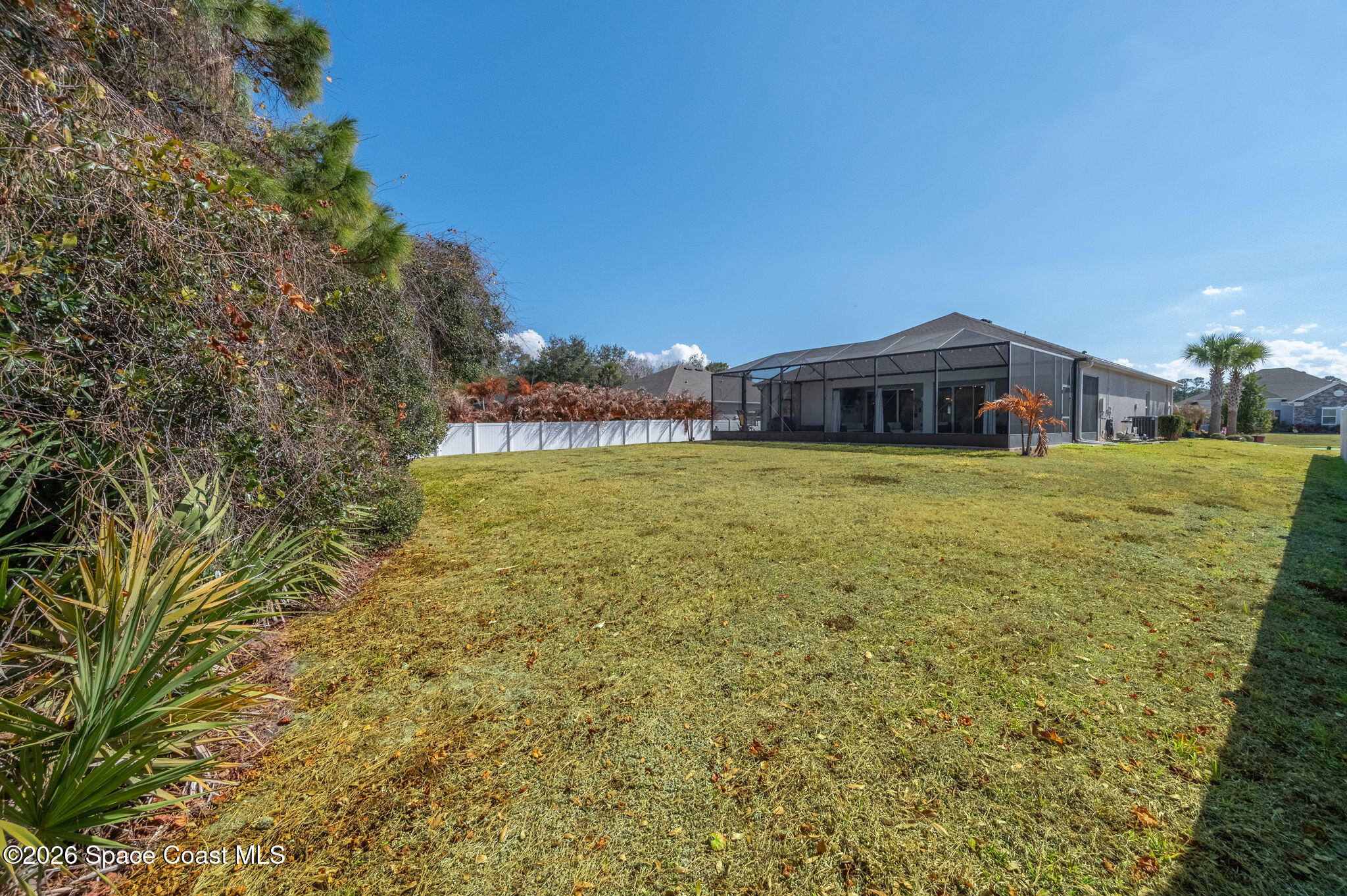 3470 Breezy Point Lane Cocoa, FL 32926 - Photo 43 of 69 a view of a house with a yard and sitting area