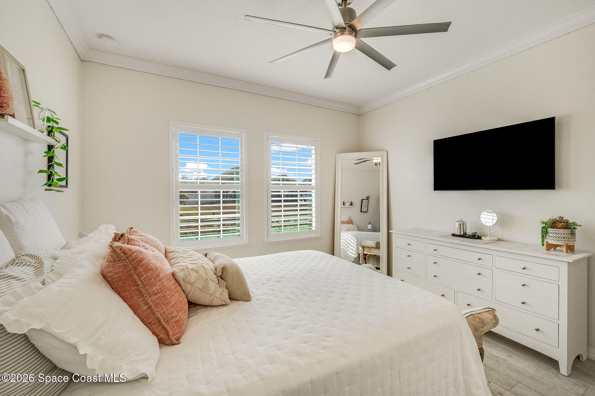 3470 Breezy Point Lane Cocoa, FL 32926 - Photo 46 of 69 a bedroom with a large bed and a flat screen tv