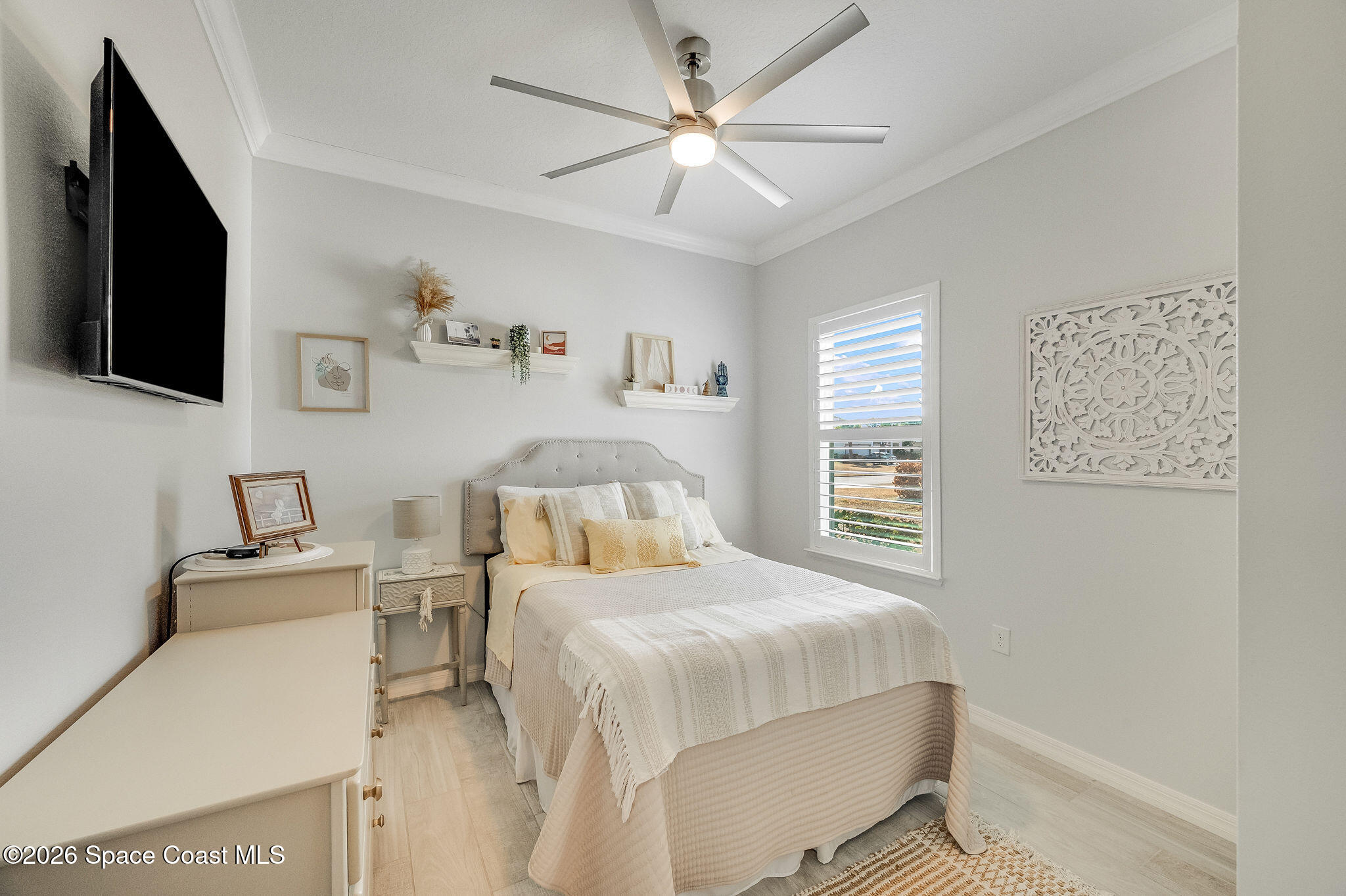 3470 Breezy Point Lane Cocoa, FL 32926 - Photo 50 of 69 a bedroom with a bed and a flat screen tv