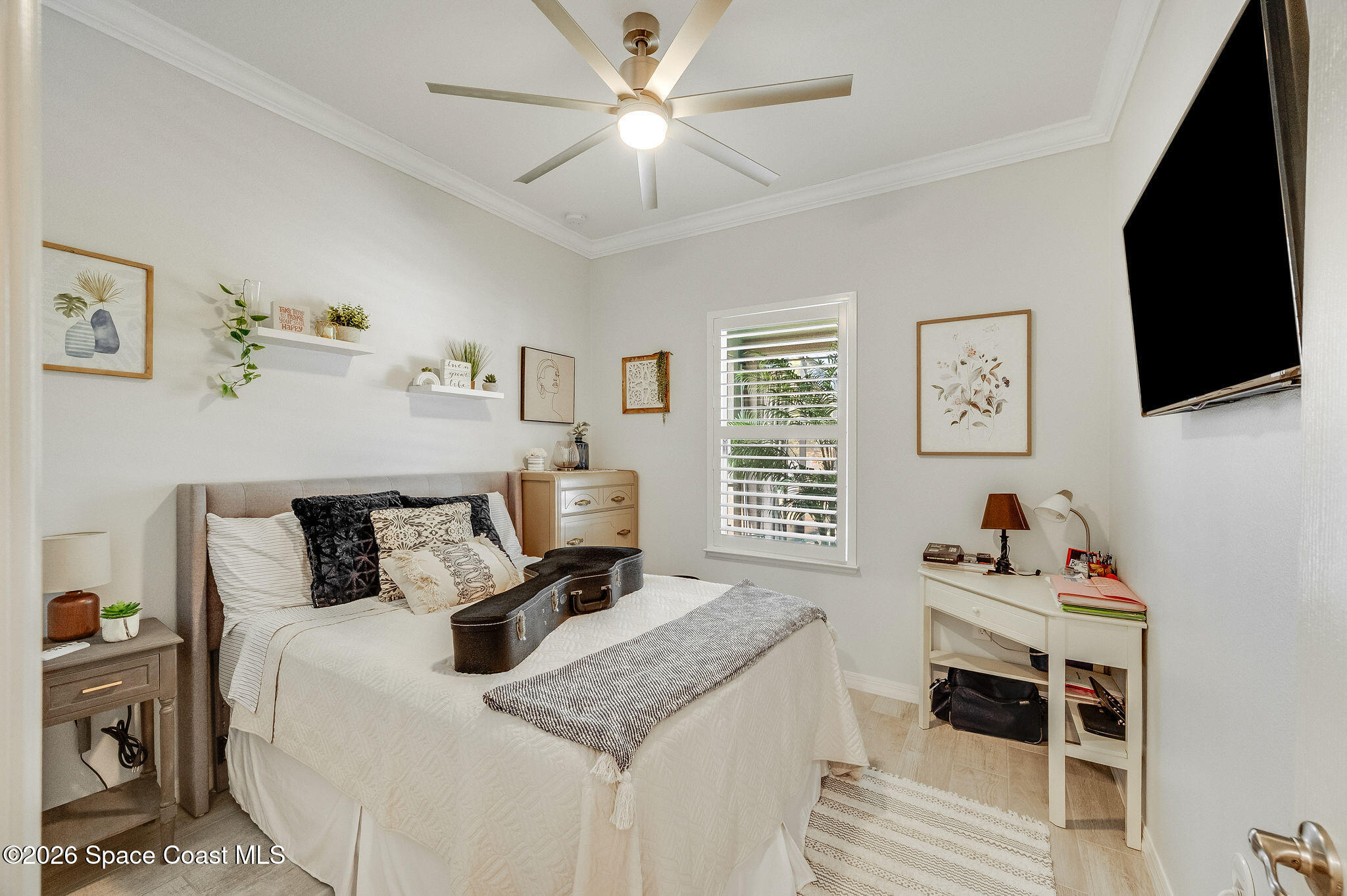 3470 Breezy Point Lane Cocoa, FL 32926 - Photo 53 of 69 a bedroom with a bed and a flat screen tv