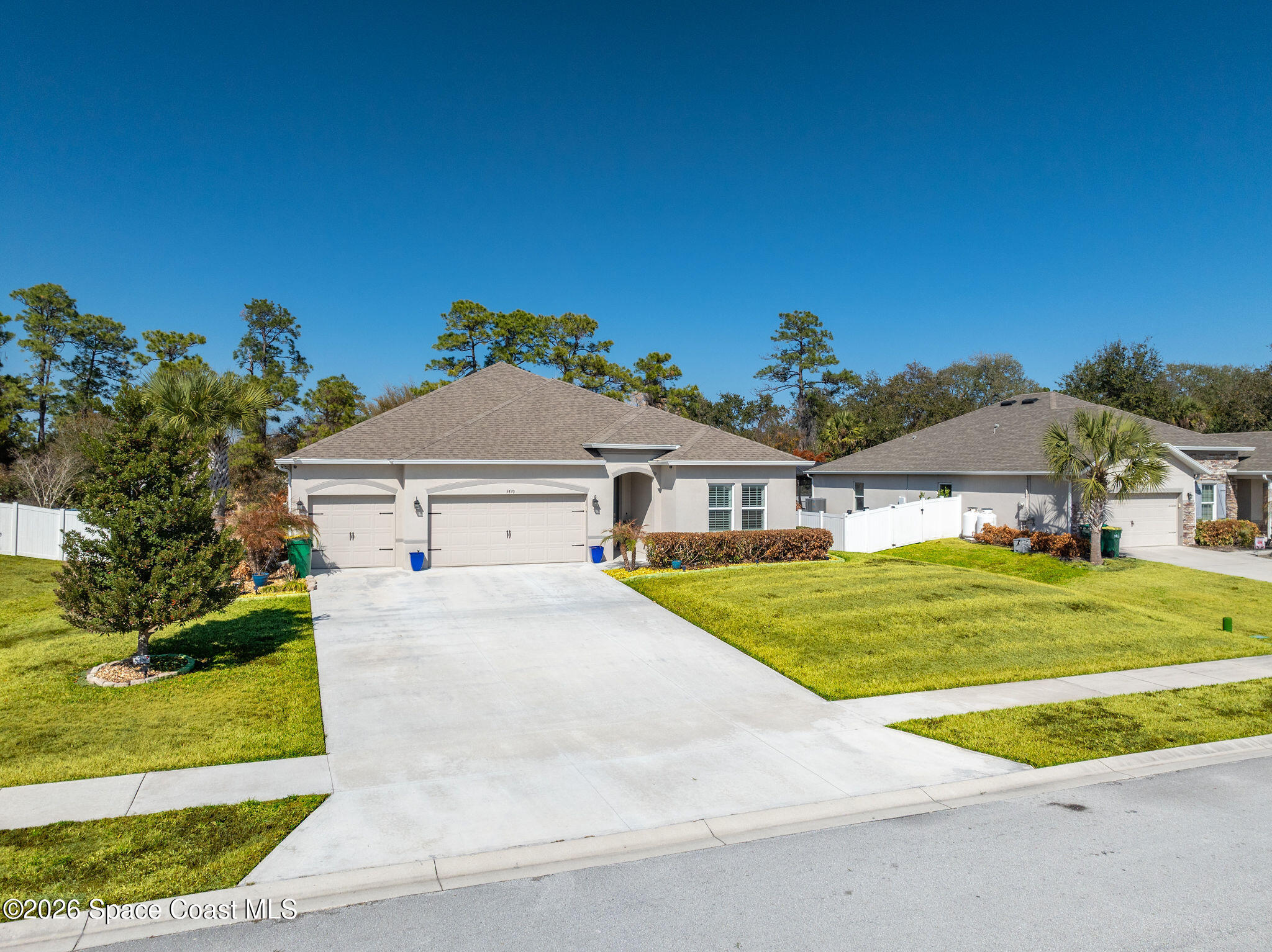 3470 Breezy Point Lane Cocoa, FL 32926 - Photo 59 of 69 a front view of a house with a yard