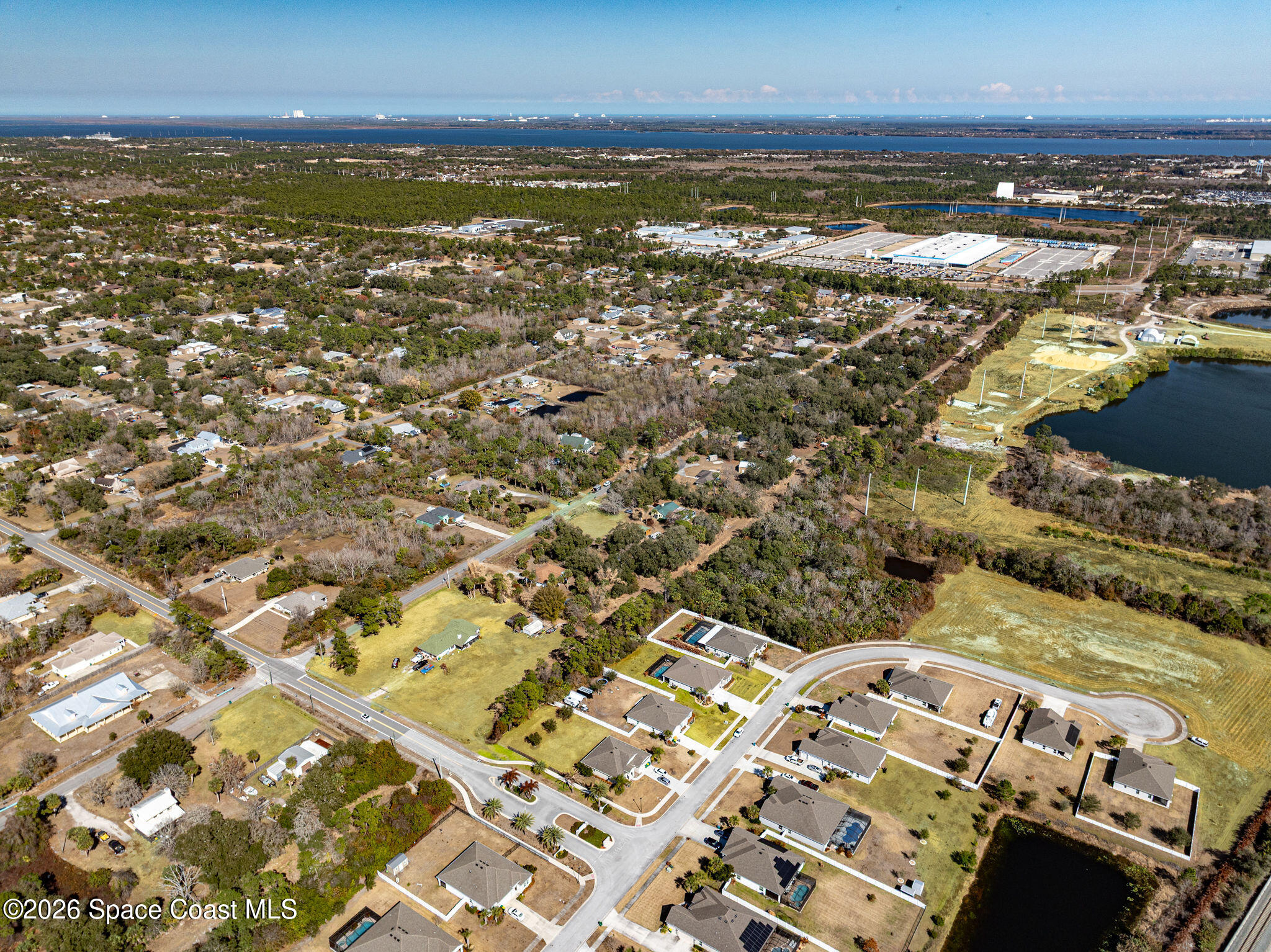 3470 Breezy Point Lane Cocoa, FL 32926 - Photo 65 of 69 an aerial view of residential houses with outdoor space