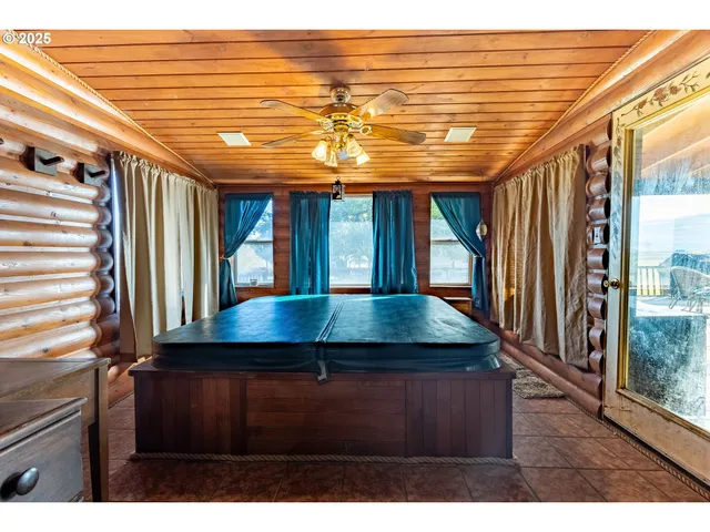 a view of a room with furniture and window