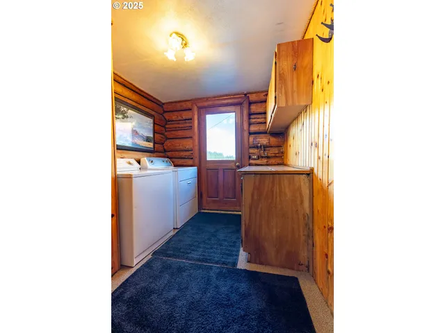 a view of a kitchen from a hallway