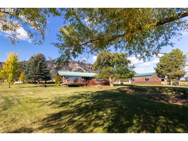a view of a house with a big yard