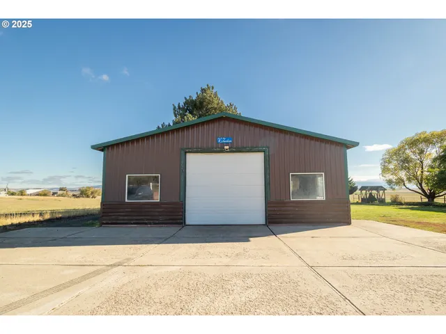 a view of a garage with a table and chairs