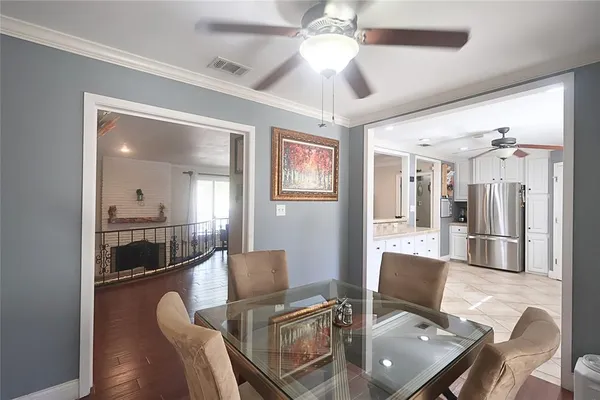 a kitchen with stainless steel appliances granite countertop a refrigerator sink and stove