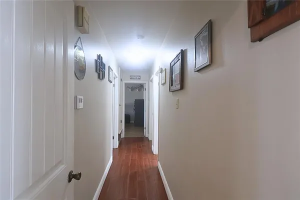 a bathroom with a double vanity sink a toilet and a bathtub