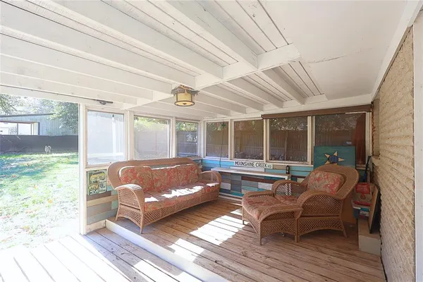 a view of a house with a yard and tree s