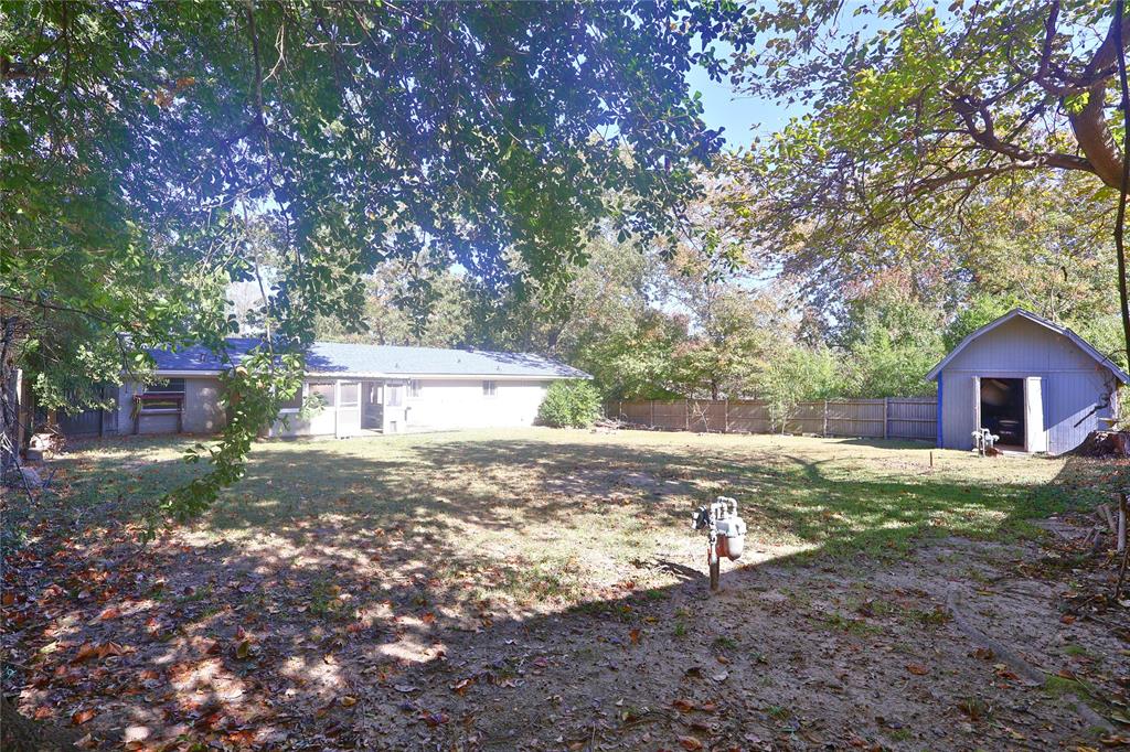 505 Colonial Drive Athens, TX 75751 - Photo 28 of 33 a view of a house with yard and a tree