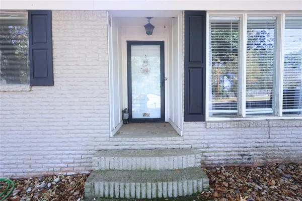 a view of a house with a sink and a yard