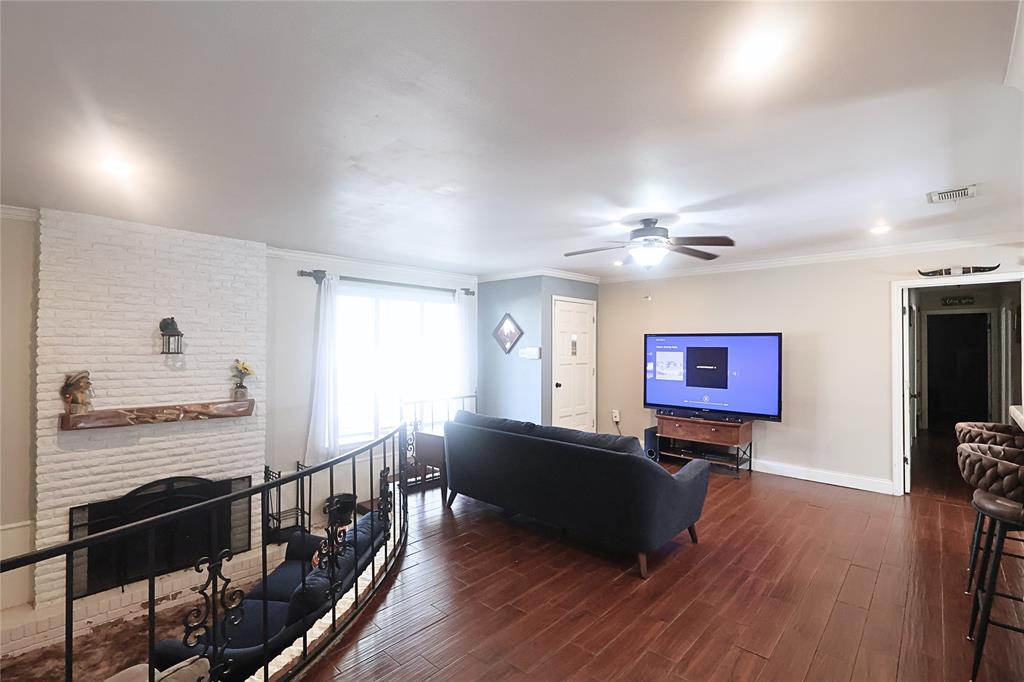 505 Colonial Drive Athens, TX 75751 - Photo 7 of 33 a living room with furniture fireplace and wooden floor