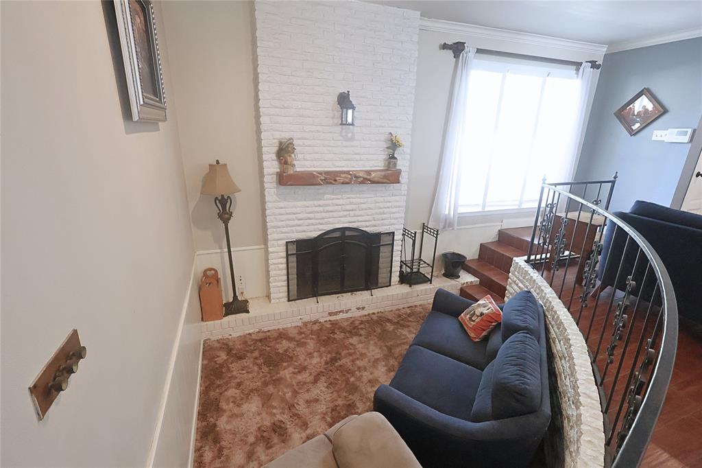 505 Colonial Drive Athens, TX 75751 - Photo 10 of 33 a living room with furniture and a fireplace