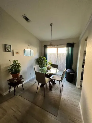 a living room with furniture and a table