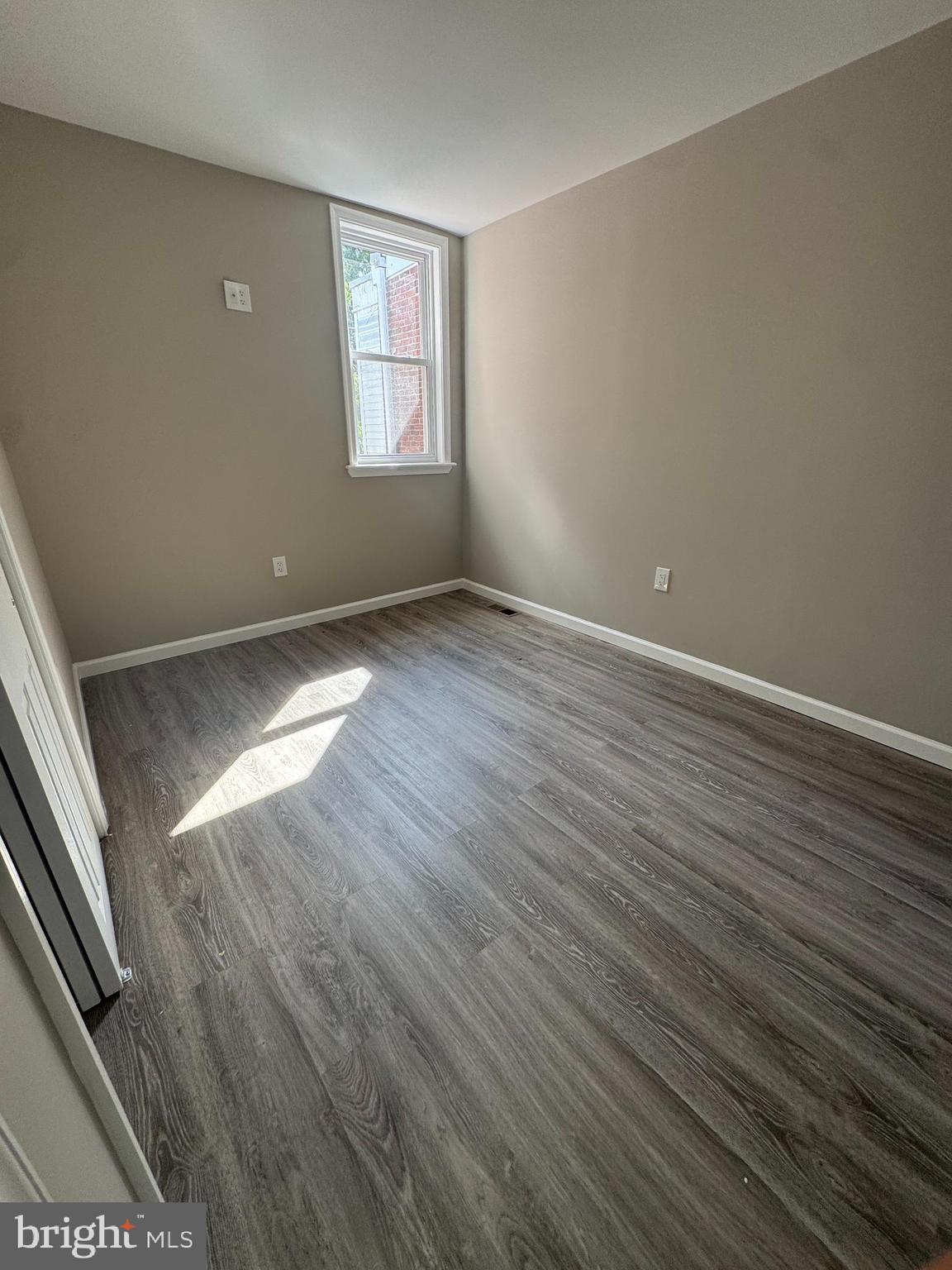 6018 Ross Street Philadelphia, PA 19144 - Photo 10 of 14 an empty room with wooden floor and windows