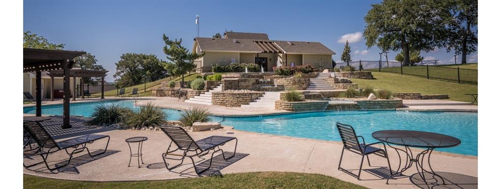 12074 Songbird Road Whitney, TX 76692 - Photo 5 of 16 a view of a swimming pool with a patio