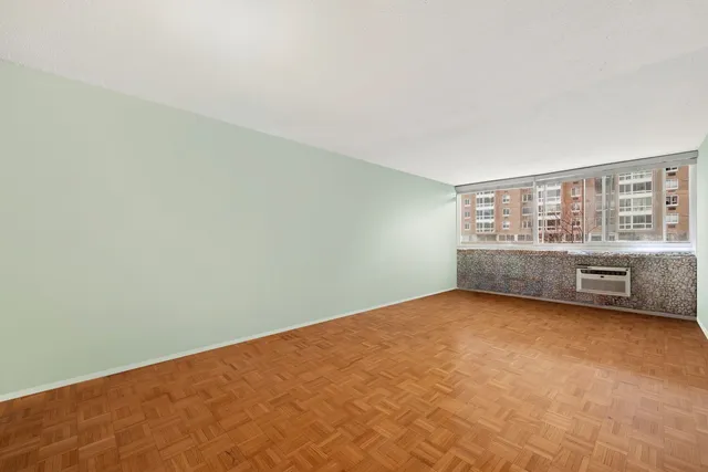 a view of an empty room with a window