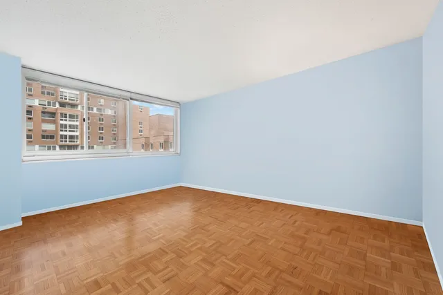 a view of an empty room with a window