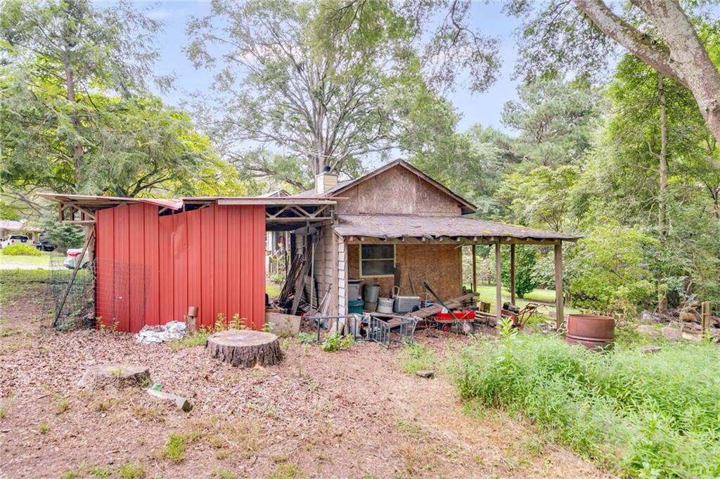 4661 Fowler Street Acworth, GA 30101 - Photo 14 of 16 a front view of a house with patio