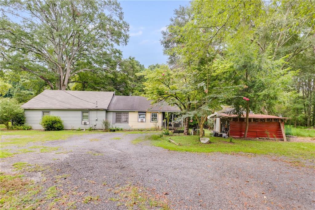 4661 Fowler Street Acworth, GA 30101 - Photo 2 of 16 a house that has a tree in front of it