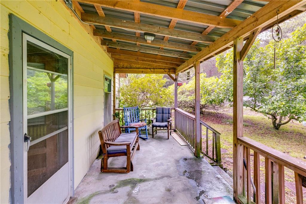 4661 Fowler Street Acworth, GA 30101 - Photo 5 of 16 a porch with a table and chairs