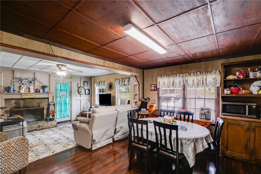 4661 Fowler Street Acworth, GA 30101 - Photo 7 of 16 a living room with furniture a flat screen tv and a fireplace
