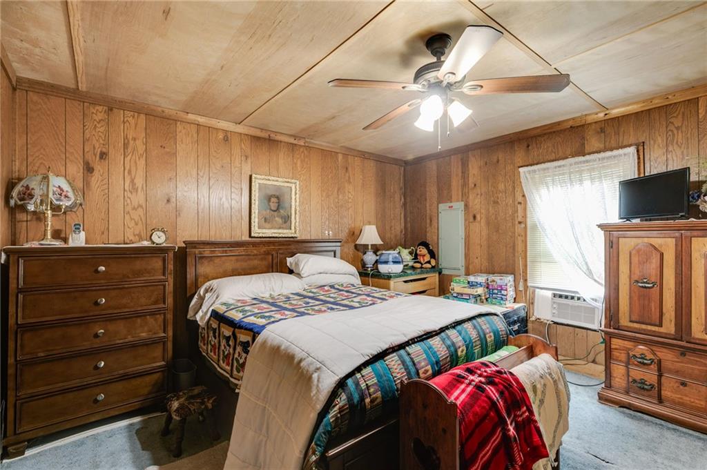 4661 Fowler Street Acworth, GA 30101 - Photo 9 of 16 a bed room with a bed and a television