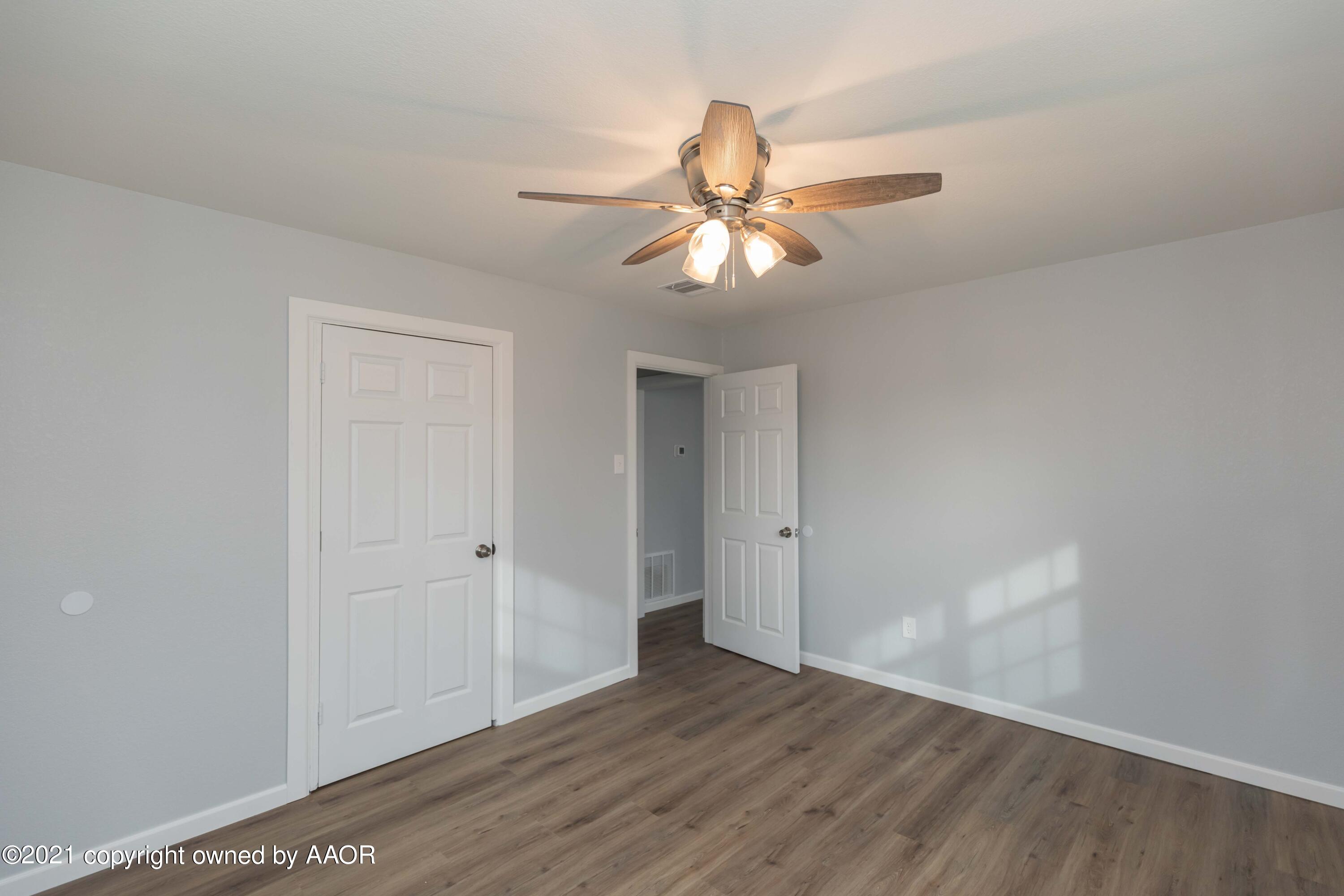 3808 Gables Street Amarillo, TX 79110 - Photo 11 of 23 a view of empty room with wooden floor