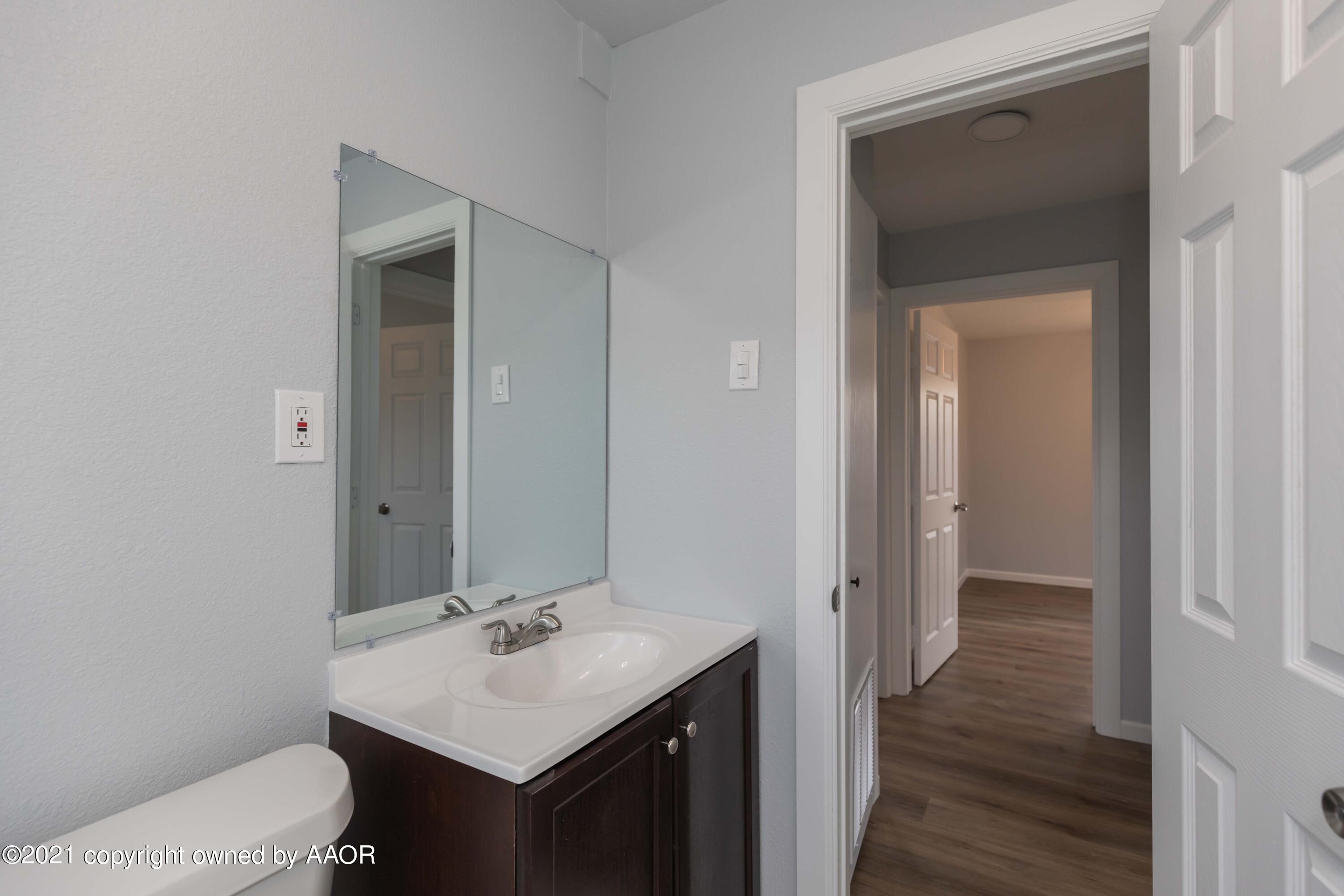 3808 Gables Street Amarillo, TX 79110 - Photo 12 of 23 a bathroom with a sink and a toilet