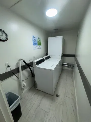 a view of a room with wooden walls