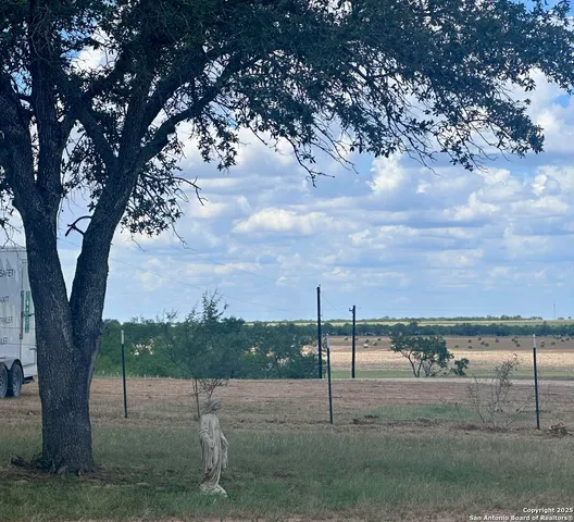 a view of a golf course with a lake view