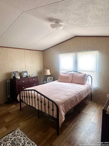 a bedroom with a bed and a table