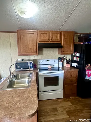 a bathroom with a toilet and a shower curtain