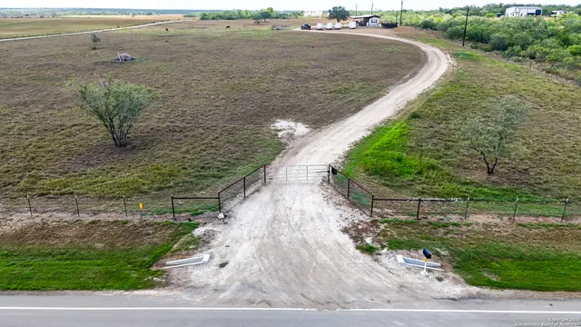 a view of a lake with beach and outdoor space