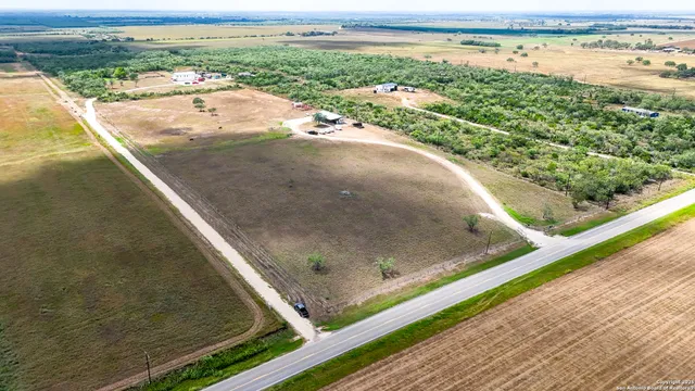 a house view with swimming pool in front of it