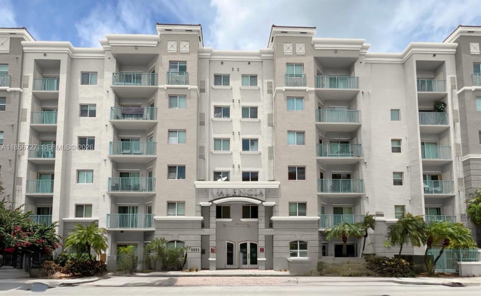 6001 Southwest 70th Street, Unit 127 South Miami, FL 33143 - Photo 1 of 13 a front view of a multi story building