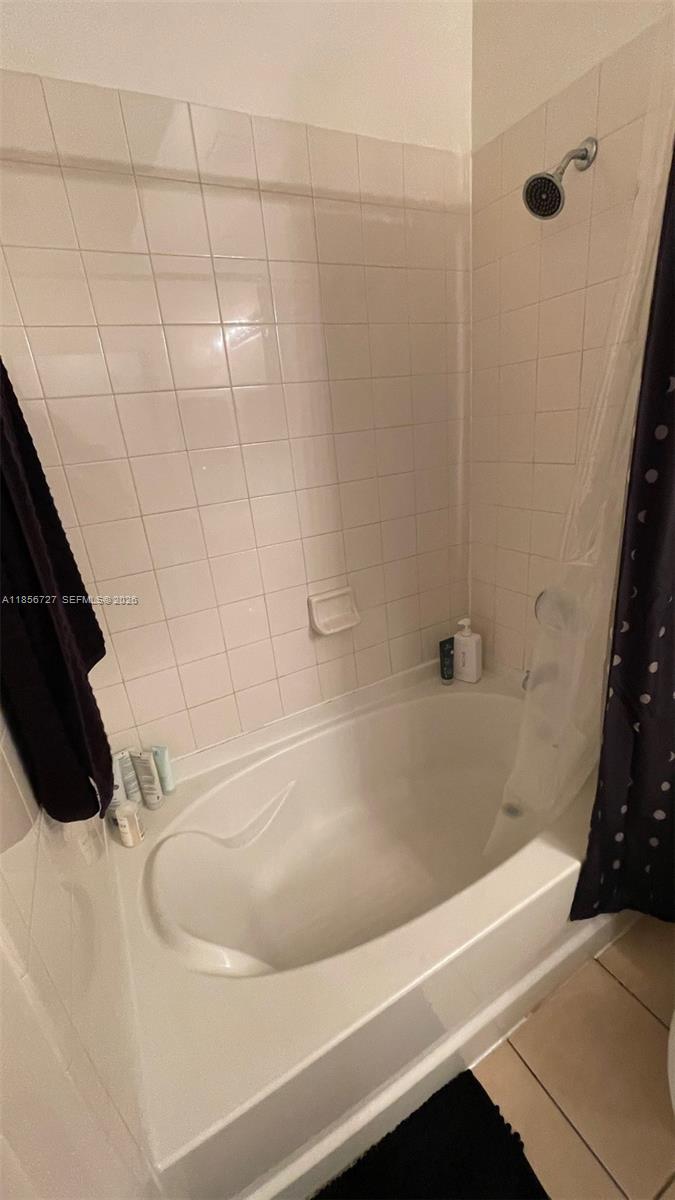 6001 Southwest 70th Street, Unit 127 South Miami, FL 33143 - Photo 13 of 13 a bathroom with a bathtub