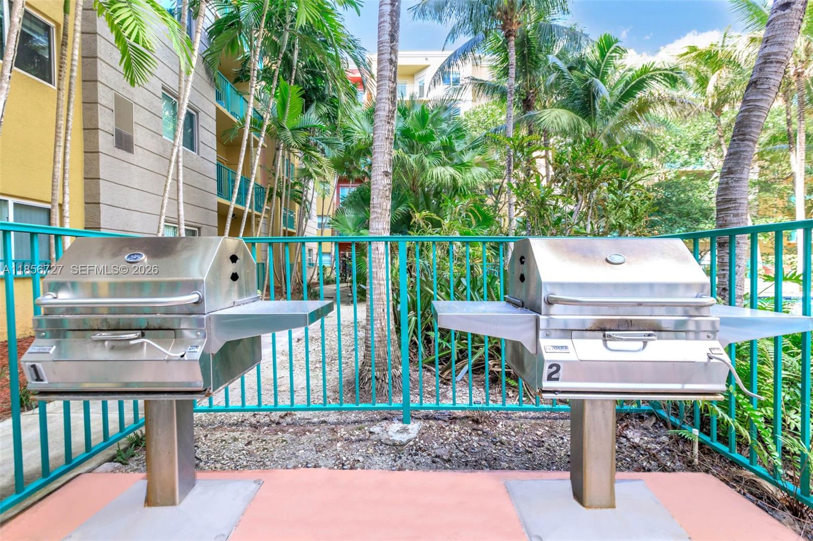 6001 Southwest 70th Street, Unit 127 South Miami, FL 33143 - Photo 4 of 13 a view of a chairs and table in the patio