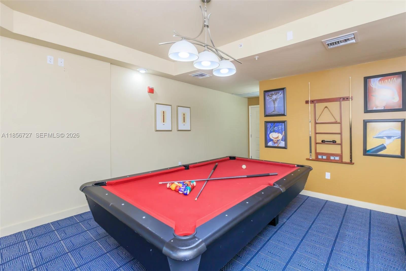 6001 Southwest 70th Street, Unit 127 South Miami, FL 33143 - Photo 5 of 13 a room with pool table and windows