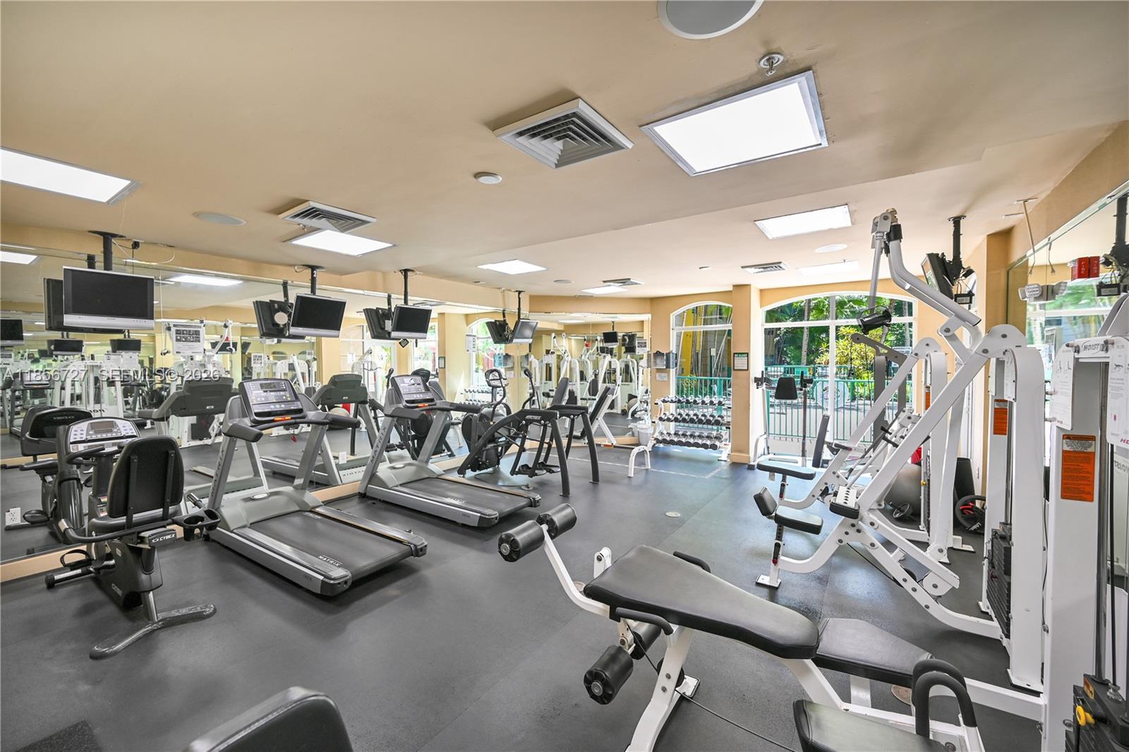 6001 Southwest 70th Street, Unit 127 South Miami, FL 33143 - Photo 6 of 13 a view of a room with gym equipment